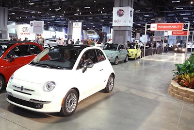 On the lower level of the Washington Convention Center, attendees can ride in a Fiat at the 'FiatRide' indoor course.