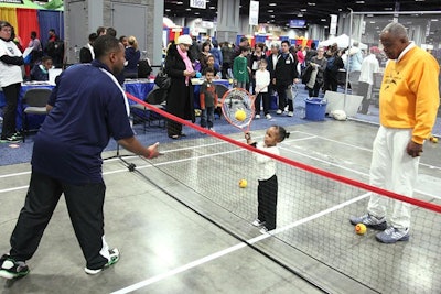 The USTA/Washington Tennis Association provided mini-tennis lessons on a child-size court.