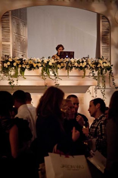 Situated on a raised platform styled after the city's elegant balconies, the booth for DJ Harley Viera-Newton was incorporated into the overall design.