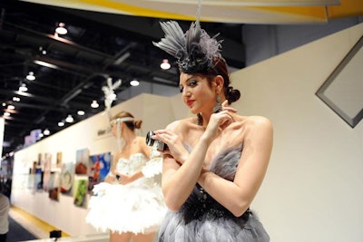 Visitors to Nikon's booth could test its newest cameras by taking shots of showgirls and models.