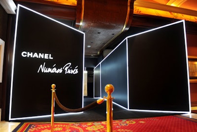 Held at the Wynn Las Vegas resort, the weekend affair celebrated the opening of an eight-day on-site exhibition called 'Numéros Privés.' The 7,000-square-foot installation was built near the Tower Suite entrance in a space formerly occupied by the restaurant Alex. On January 20, the 200 invited guests entered the exhibit through a narrow hallway flanked by custom walls trimmed in neon lights.