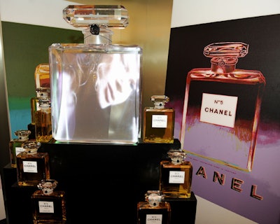 Guests also had the opportunity to take a playful look at the fashion house's most iconic symbols, the lion, the clover leaf, the double intersecting Cs, the number five, and the perfume bottle. The pop art room was marked by silk-screened images of the Chanel No. 5 bottle.