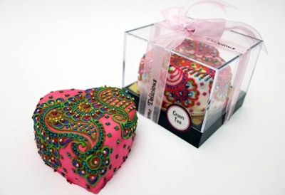 The elaborately frosted cakes from Crème-Delicious come in individual acrylic boxes.