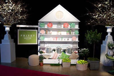 An elegant tableau served as the backdrop for the introduction of Connecticut-based home goods store Privet House. Flowers, topiaries, and fruit filled the shop's Target collection products, while the slogan, 'A treasure trove of wonderful wares from Connecticut,' emphasized the brand's aesthetic.