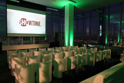 Organizers created a theater on the 30th floor, with a combination of seating and standing room. The group brought in white suede seats, silver couches, and aluminum communal tables with tall white chairs.