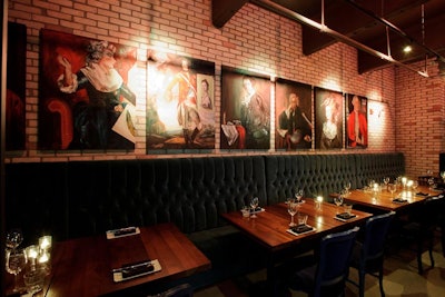 Local art hangs on the exposed brick walls of the dining room.