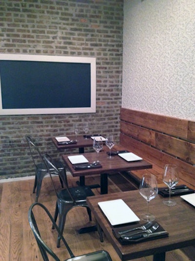 With chalkboards, barn wood, and exposed brick, the venue has a rustic look.