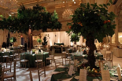 Real tree branches and miniature faux tree centerpieces were part of the garden motif.