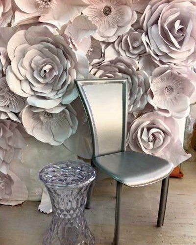 The Chanel Flower Screen, available to rent through Ruth Fischl, $700 per panel, can function as a room divider, back-bar display, or arrivals backdrop.