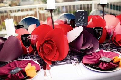 Custom paper flower displays, like these designed by Ara Farnam of Rock Paper Scissors Events in New York, can replace pricier fresh flower centerpieces.