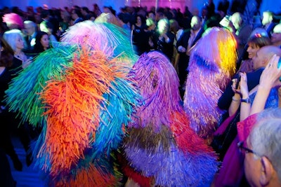During the cocktail reception, dancers dressed in Soundsuits from artist Nick Cave shimmied through the crowd and playfully interacted with guests. The suits are made with fabric, plastic, metal, hair, and other materials that make sounds when rubbed together.