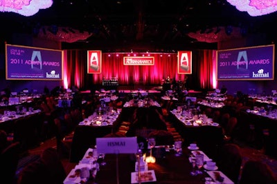 Dessert and the award ceremony took place inside the Broadway Ballroom, where organizers employed a 'less is more' approach with clean graphics and simple table settings. A live band played on one side of the stage, and, to balance it out, a table of the Adrian Award trophies stood on the other.
