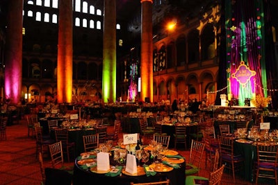 Decor for the Fat Tuesday fete kept within the traditional purple, green, and gold color scheme, with two stages in the National Building Museum’s grand hall.