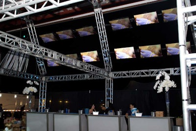 The event production company also suspended other elements, including TV screens above the main bar. Hung at a 45-degree angle, the monitors displayed an array of Adidas video content.
