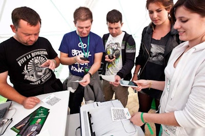 Technical staff inside the tent assisted attendees in creating and printing their stickers.The company said QR codes are still relatively new in Poland so many guests said they were seeing them for the first time.