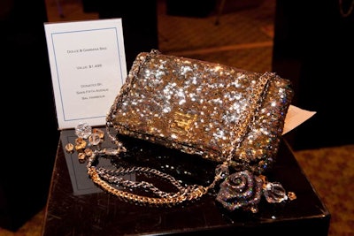 Saks Fifth Avenue in Bal Harbour donated a gold-sequined Dolce & Gabbana purse valued at $1,495 to the silent auction.