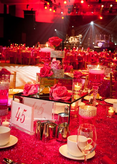 Some centerpieces showed off mirrored boxes and crystal-encrusted candle holders filled with pink water.