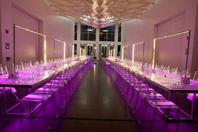 Dinner took place in the Kovler atrium, which held long, clear tables embedded with color-changing LED lights. Down the center of the tables, illuminated frames created what Heffernan referred to as 50 'light planes.'