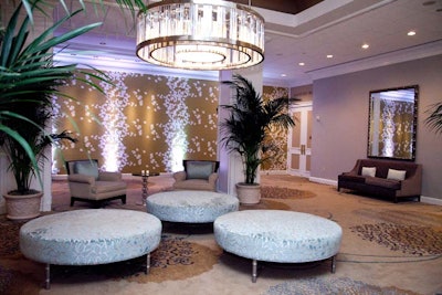 Designers incorporated a mix of gold and silver, accents of soft green, and fresh white trim throughout the ballroom and meeting spaces.