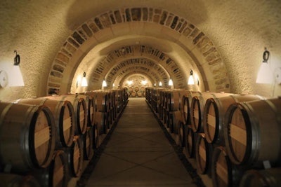 Wine casks sit in storage in the cave room.