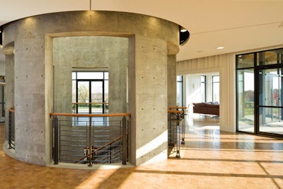 A concrete staircase in the foyer leads guests downstairs to the cave room and the fermentation room.