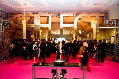 The entrance to the event was marked by a bright pink carpet and gold 'Reflect' sign.