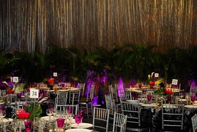 Linens with silver sequins inspired the look for the evening, complemented by purple uplighting.