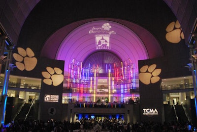 Flashing paw prints projected onto the ceiling of the Ronald Reagan Building's atrium appeared as if they were dancing.