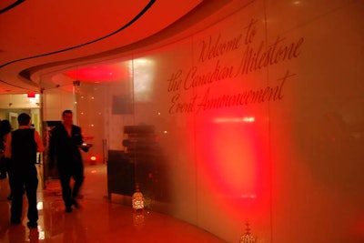 The entrance of the Ritz-Carlton Spa was uplit in red and lined with lanterns. Details about the announcement were kept secret.
