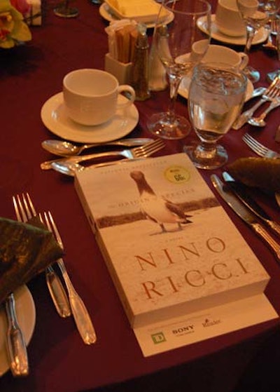 A book from each table's author served as the place setting.