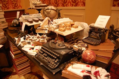 Stacks of books supported and decorated the dessert tables. Typewriters, globes, and open books added to the presentation.