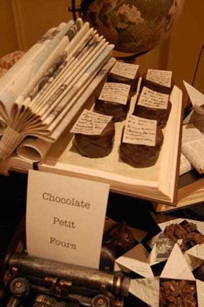 Desserts were served on open books. Chocolate petit fours were topped with a decorative page of writing.