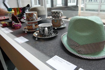 Items from past designer collaborations, like a Eugenia Kim for Target fedora and Missoni for Target mugs, filled display boxes.