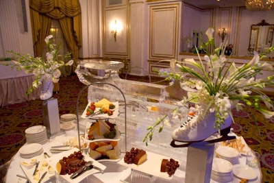 The buffet table held cheese, fruit, and crackers, and flowers spilled out of ice skates.