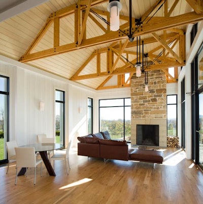 The light-filled tasting room on RdV Vineyard's first floor includes a fireplace and contemporary furniture.