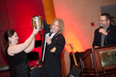 Tom Hamilton of Aerosmith helped lead the live auction.