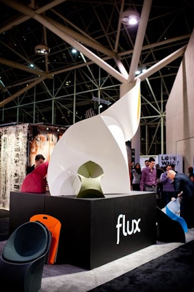 Flux's foldable, stackable chairs were on display at the entrance. A staffer demonstrated how to fold them in less than 10 seconds. The chairs were used as seating for a speaker series at the Krups Stage.