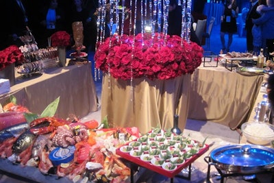 Swarovski crystals cascaded over red roses at Wolfgang Puck's seafood display at the preview.