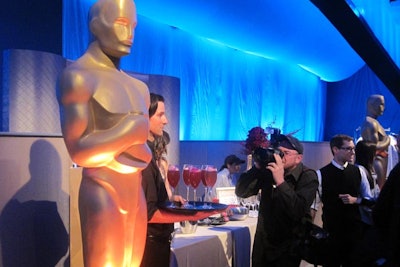 A giant Oscar statuette stood sentry while international news crews gathered their shots at the preview.