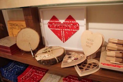 A selection of Valentine's Day-appropriate gifts include a box of wooden chocolates and the Sweetheart Carving Kit with Vintage Knife, a slab of wood that you can carve your initials into.