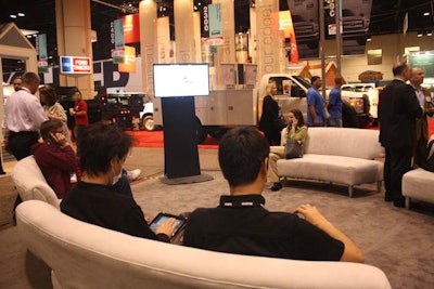Cort Event Furnishings supplied several cream-colored lounge pieces that organizers placed around the I.B.S. Live area. In one corner the show's Twitter feed scrolled on a monitor.