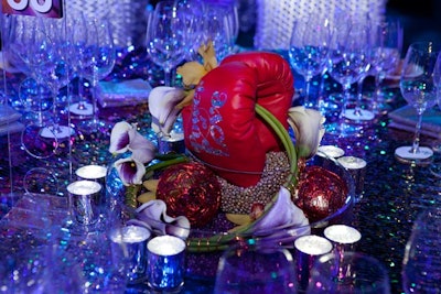 Logoed boxing gloves combined with flowers in tabletop centerpieces.