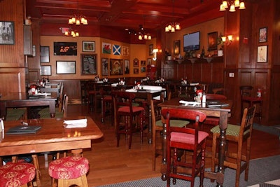 Dark wood gives the Pub a clubby feel. Seating is a mix of booths, tables, and high-tops.