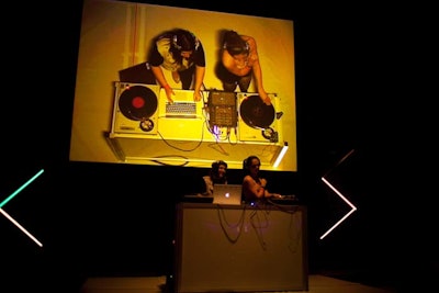 Marsha and Sandra Krcmar, a duo known as DJ Kissette, spun onstage. A video taken from overhead was projected onto a screen behind them.