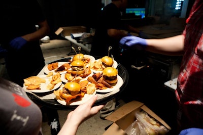 Waitstaff served mini burgers from Bareburger and chips in paper cones.