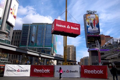 A crane lowered a branded shipping container weighing 15,000 pounds from 30 feet in the air.