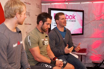 Last year's Fittest Man on Earth Rich Froning Jr. (pictured, center) and Graham Holmberg (far left), 2010's Fittest Man on Earth, chatted with Chris Froio, vice president of fitness and training at Reebok in the tent during the media event.