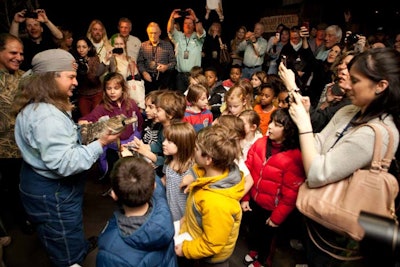 On opening day, students from two local schools gathered to learn about reptiles, swamp life, and conservation.