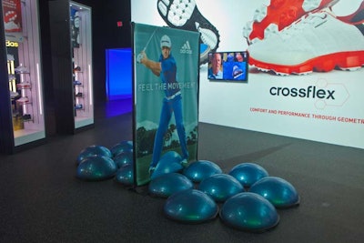 A display for the new Adidas Crossflex shoe included several BOSU balls, which are often used for balance training.