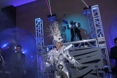 As part of the night's galactic theme, performances included dancers dressed in silver costumes with tinsel.